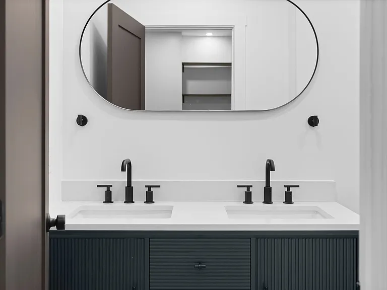 Second full bathroom with subway tile and quartz vanity