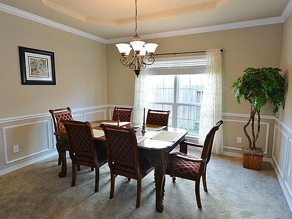 Walking into the home through the foyer is the formal dining room with great space.