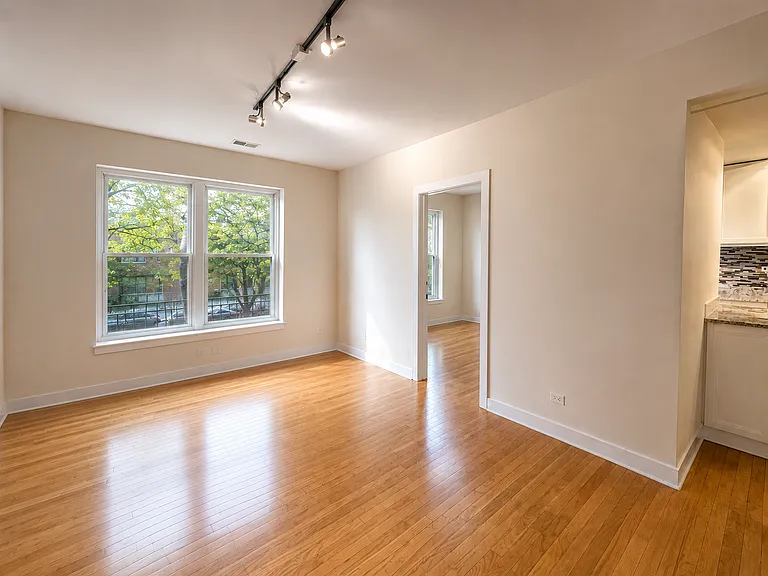 Photos of 1st floor unit of same floorplan. Actual is on the top floor, 3rd. Living room