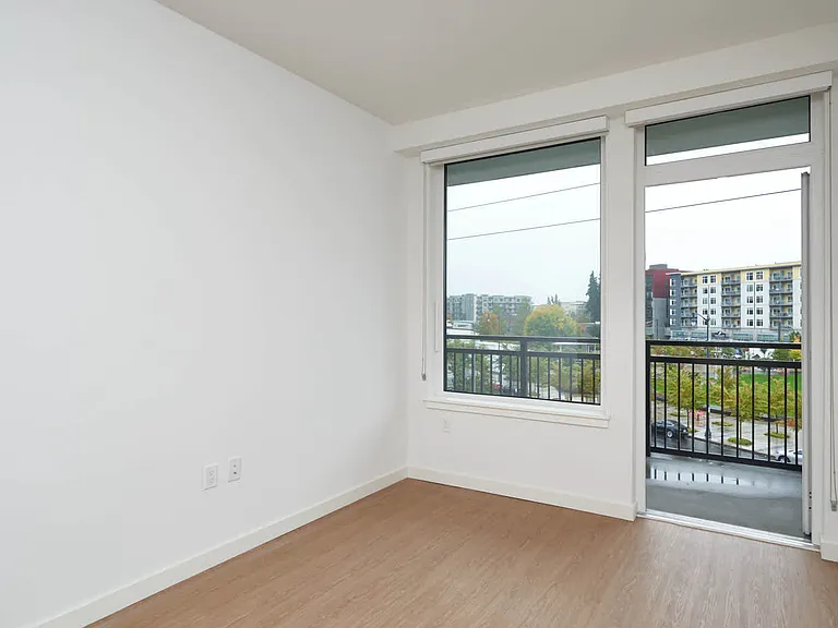 Bedroom with Balcony and Hard Surface Flooring