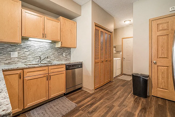 Our upgraded homes feature hardwood-style flooring and tile backsplash. Every home includes a washer and dryer.
