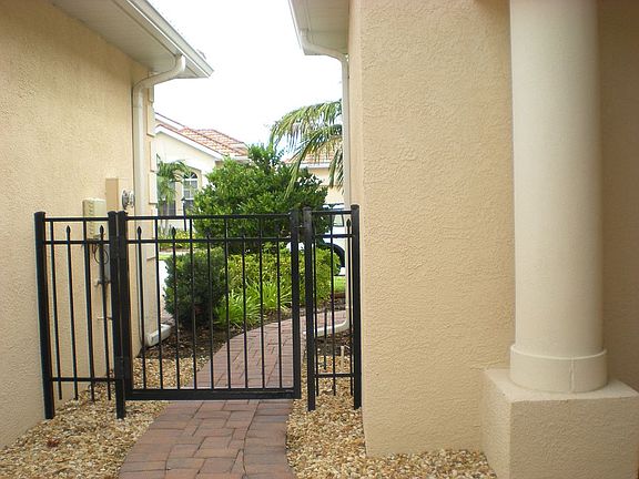 Iron gate at walkway adds so much character!