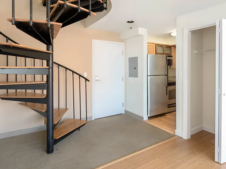 The Lofts - Apartment Entrance with Spiral Staircase