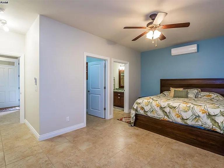 Master bedroom with ceiling fan and air conditioning, Open door is closet and master bath.