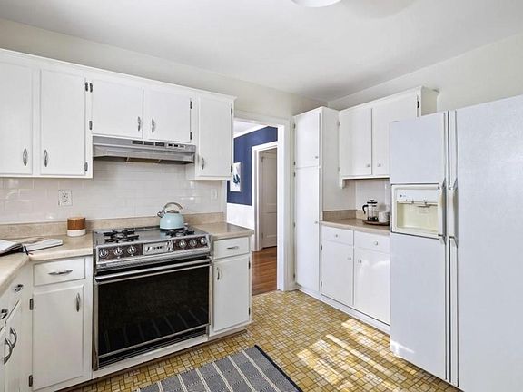 Kitchen with plenty of cabinet storage and updated gas range.