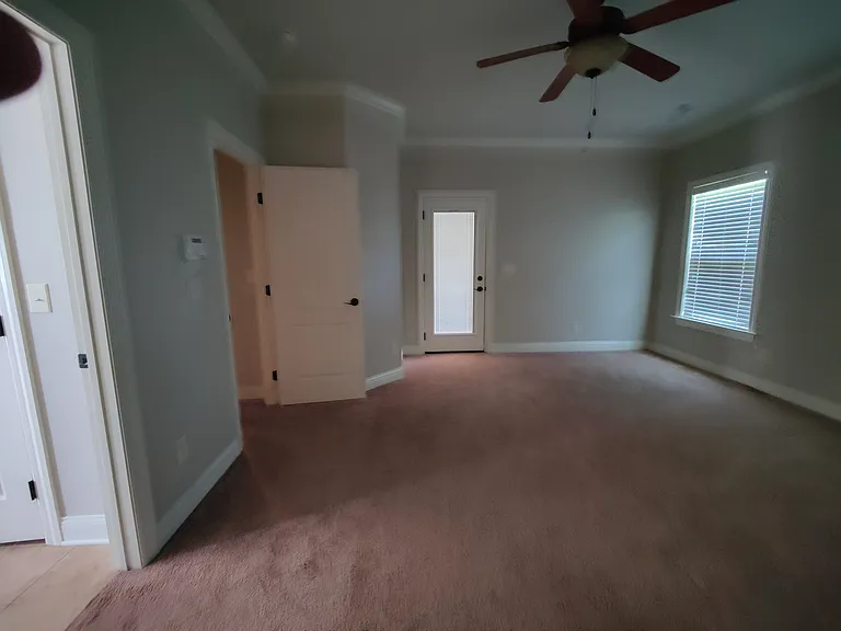 Master bedroom has a door to back porch.