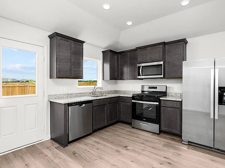 The kitchen has energy-efficient, stainless steel appliances.