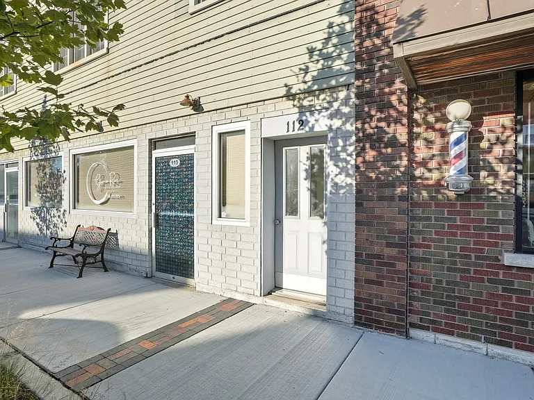 Separate entrance for the two upstairs apartment, always secured. Barbershop next door.