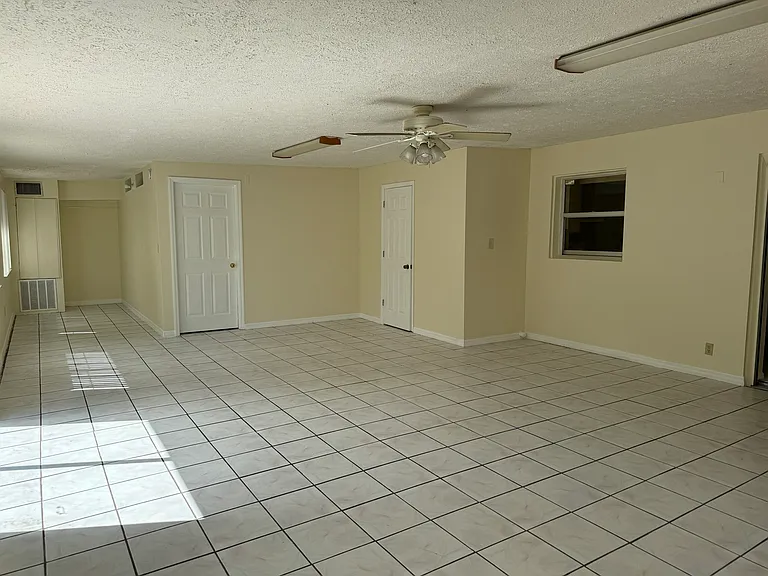 Sunroom, with nook (left) and bedroom #4 (left of center)