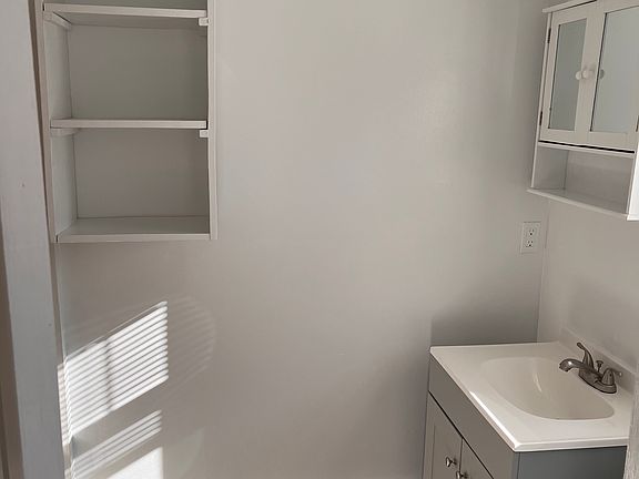 Bathroom w/ brand new vanity and shelves