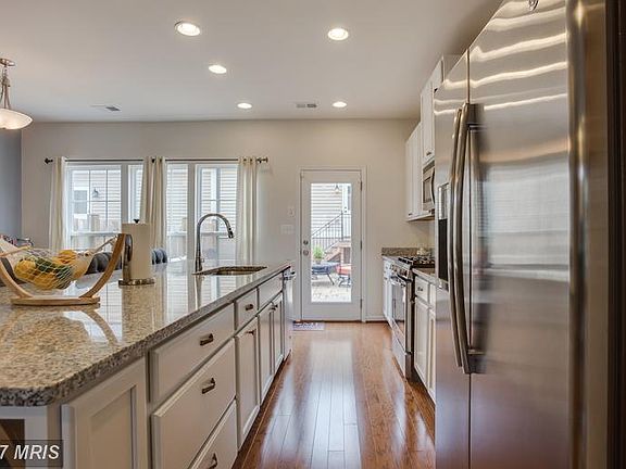 Kitchen opens to outdoor living! Stamped patio!