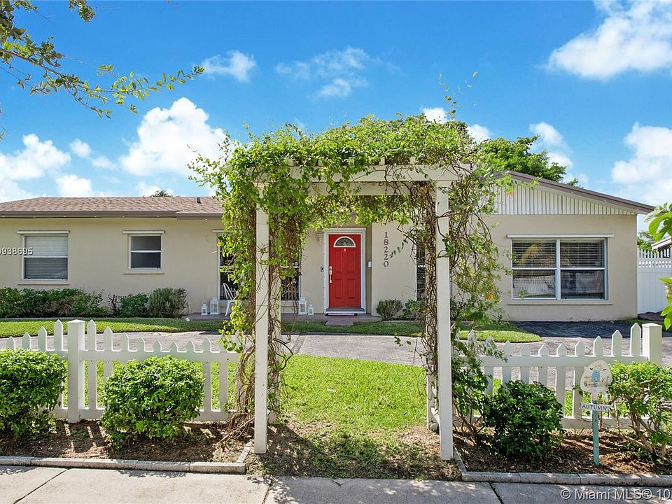 White picket fence line this charming home