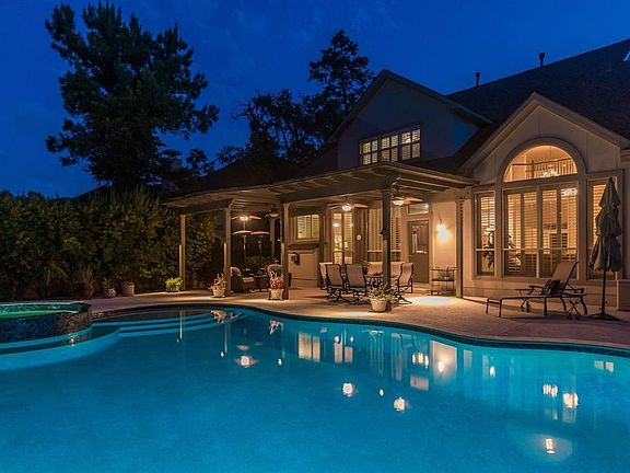 Wow, not only does it have extreme curb appeal, but a backyard paradise. A 30,000 gallon heated pool with tanning ledge, spa and extended patio with pergola, makes for the perfect dream backyard!