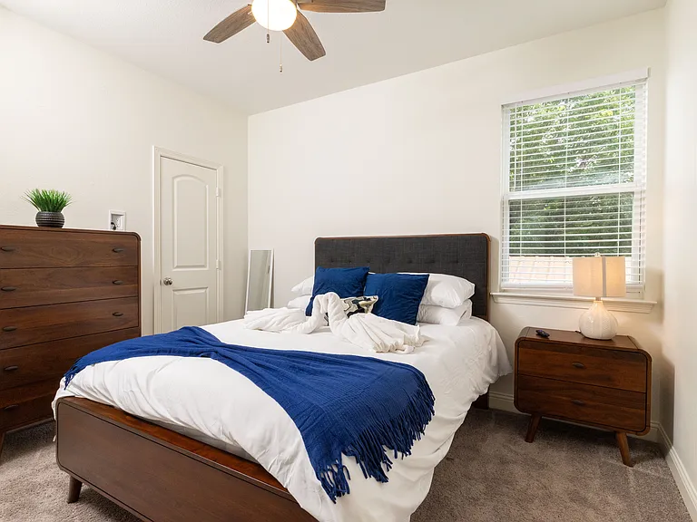Bedroom 2 offers a cozy queen bed and a flat-screen TV_perfect for unwinding in comfort.