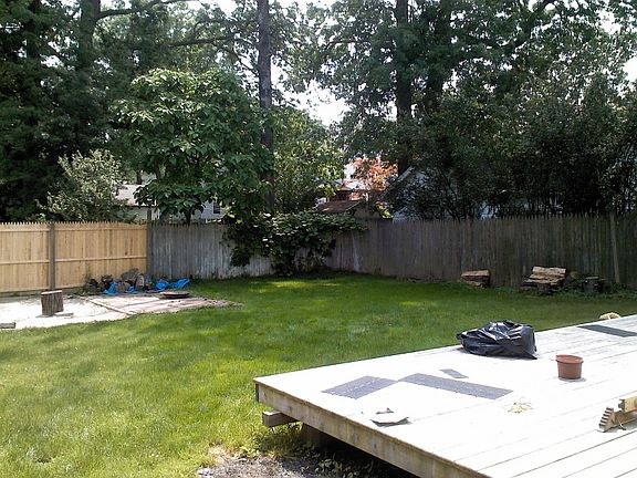 Updated yard with private fence and deck