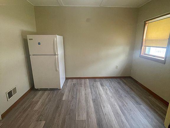 Dining area. Refrigerator location can be adjusted to accommodate tenant preferred set up.
