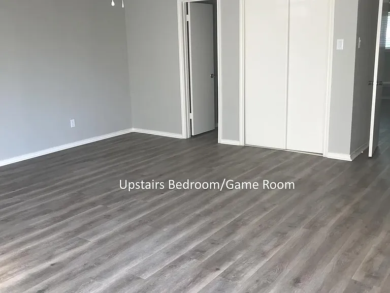 Larger upstairs bedroom leading to bath. 3 closets