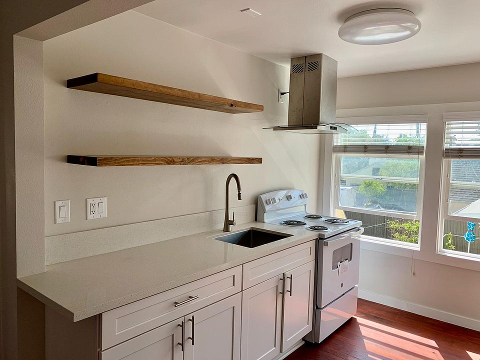 Just remodeled: all new appliances, new cabinets, new custom countertops, and floating shelves.