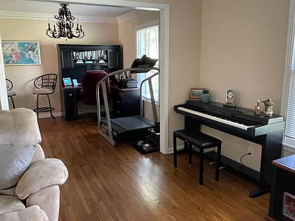 Den showing opening into Dining Room now being used as Exercise room