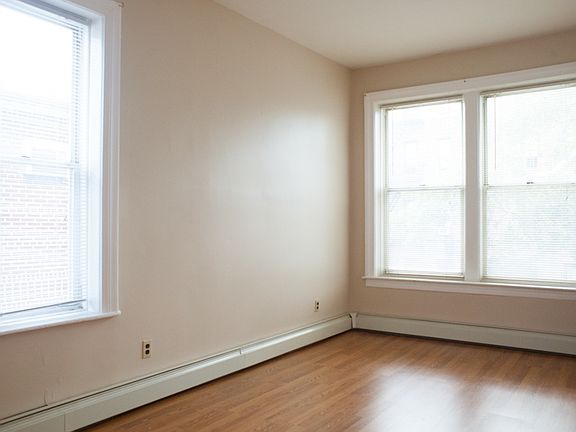 Bedroom with windows (also has two closet space).