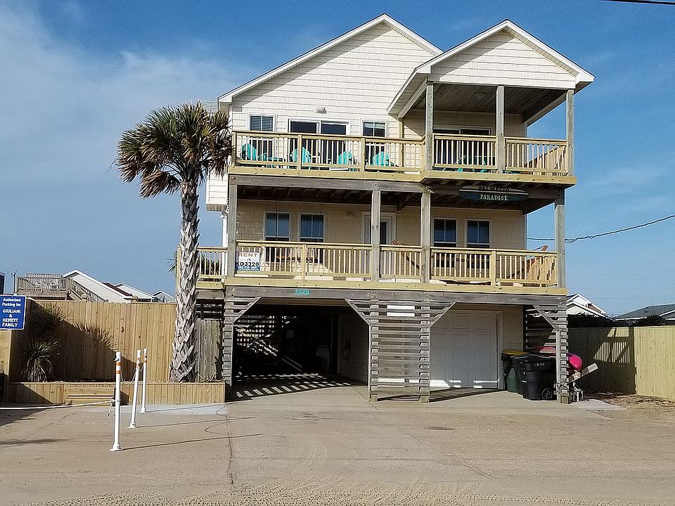 Front of house with large driveway