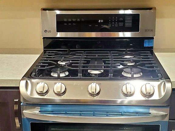 New gas stove and over the range oven.