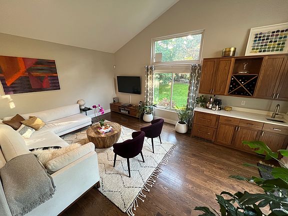 View of the wet bar and TV living room that faces the west side of the yard. You can also access the patio through sliding doors next to the wet bar.