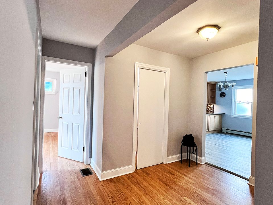 Central hall with entry closet connecting all areas of the house. To the right = kitchen, living room, 3rd BR. To the left, 2nd BR, Bathroom, Master BR.