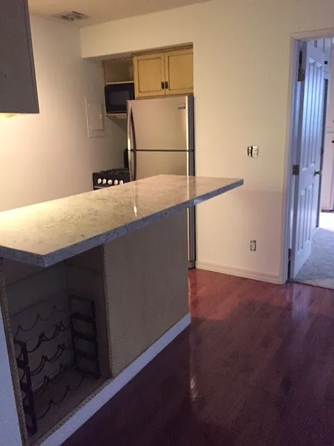 New Granite Counters plus Stainless Steel Refrigerator