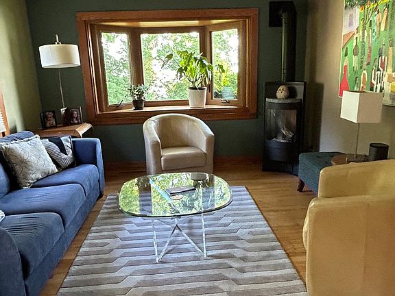 Living room with gas fire place and lake view