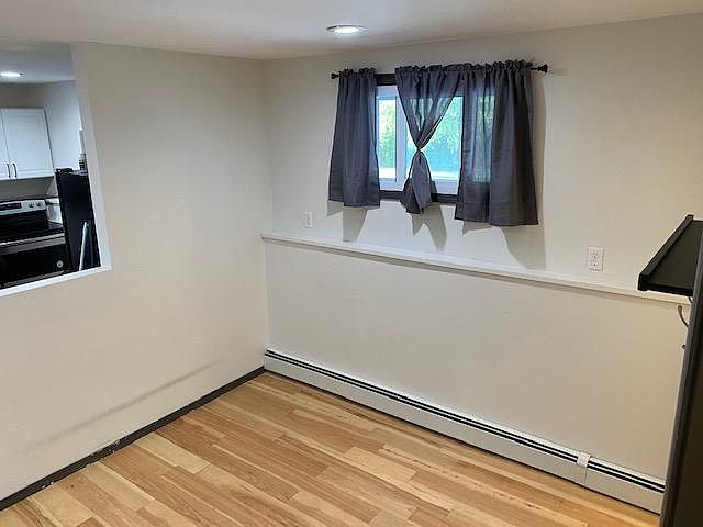 Downstairs living area, kitchen on left.