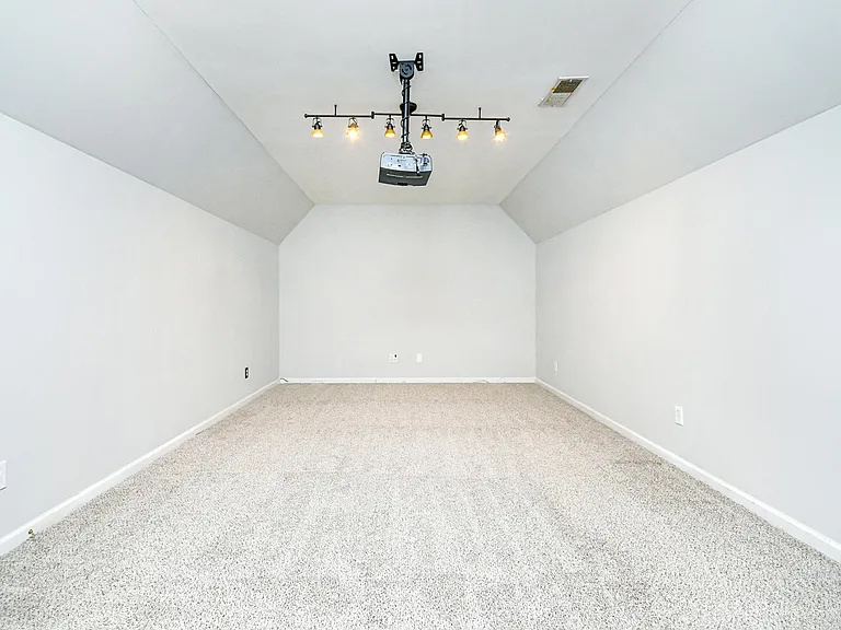 Media Room with a Projector and ceiling mounted speakers
