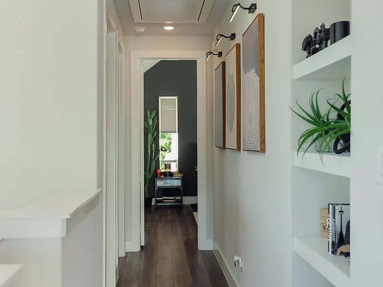 Hallway to primary and guest suites.