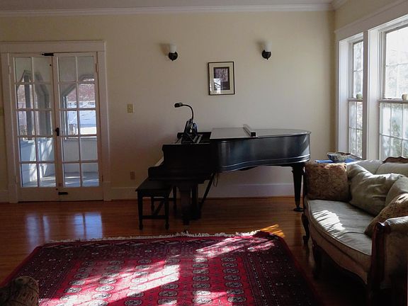 Living room looking out to screened-in porch