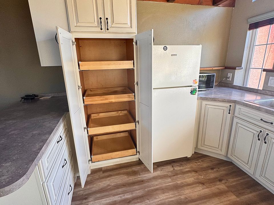 Full kitchen with large pantry closet.