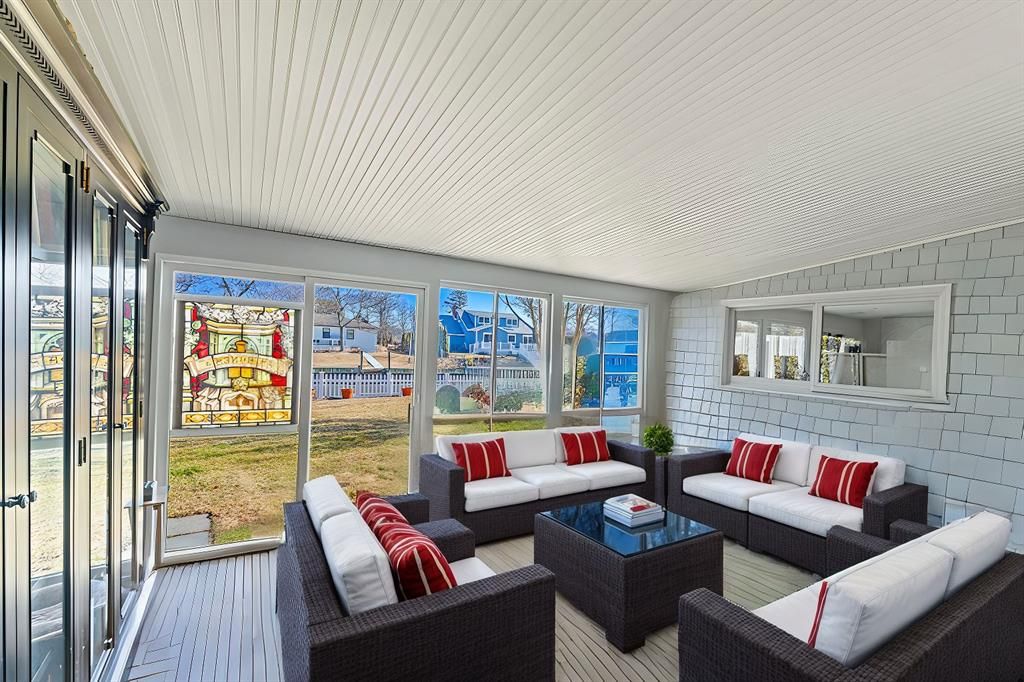  View of sunroom with waterviews