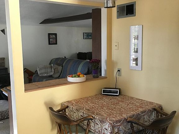 Corner of Kitchen with open view of Living Room. (This furniture not included with rental )