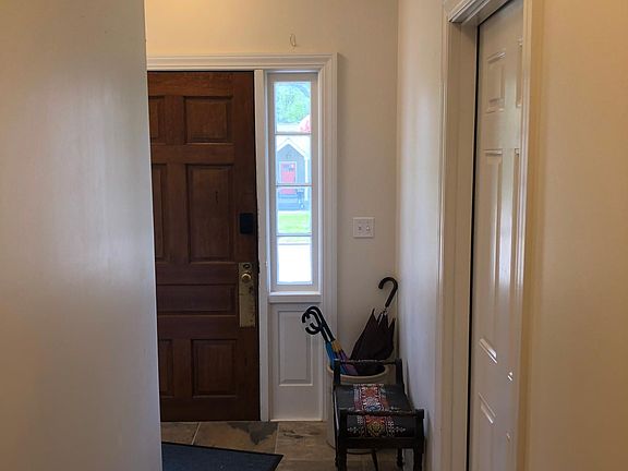 Front entrance hallway with door to the apartment on the right