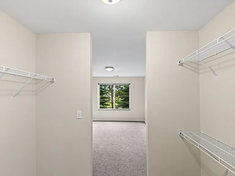 Elevate your living at Overlook Ridge. This spacious closet offers ample storage with a bright, inviting atmosphere. The stylish design and abundance of natural light create the perfect backdrop for your belongings. Schedule a visit today!