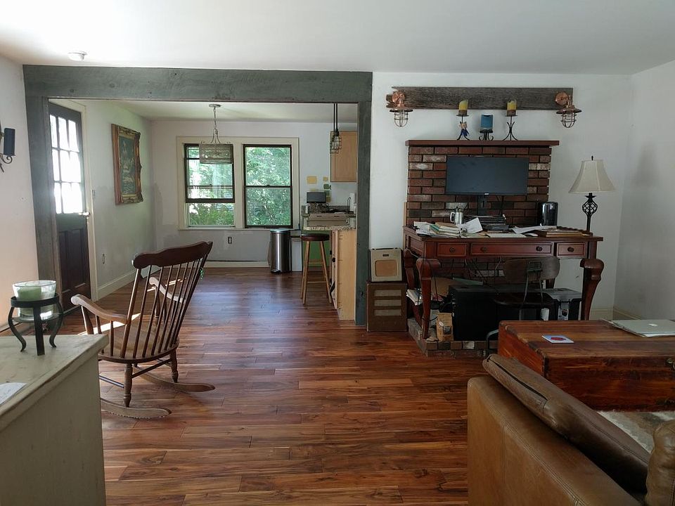 Living room open to deck, dining room and kitchen.