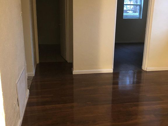 Living room view looking into master bedroom and bathroom