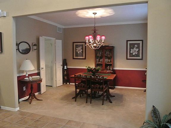 FORMAL DINING CONVENIENTLY ADJACENT TO KITCHEN.