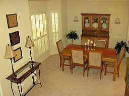 Entry with wood floors opens to the dining room, which is nicely set apart.