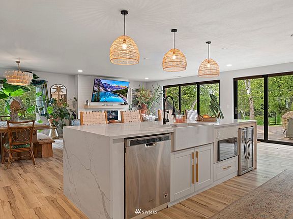 Fully renovated chef's kitchen with a wine fridge.