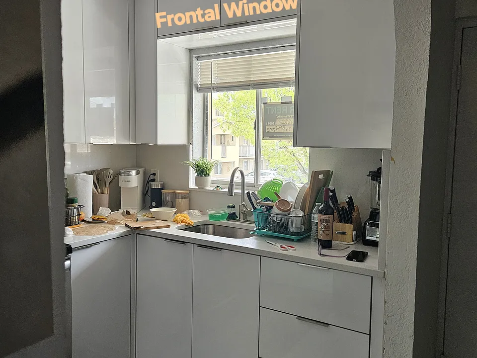 Kitchen Sink Window Facing Building Front