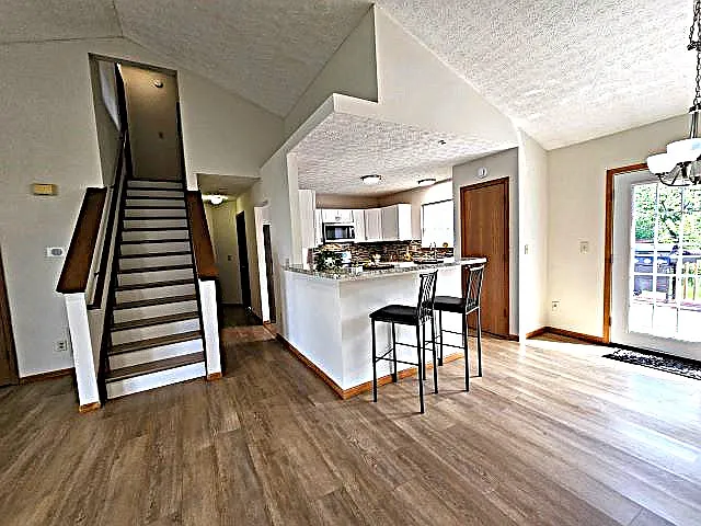 Steps to great rm, breakfast bar counter, dinette area, double doors to decking, fenced yard.