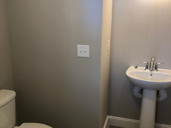Downstairs half bath/ laundry room 