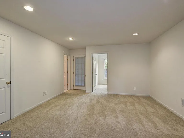 First floor family room area with 4th bedroom and full bathroom. Walkout to backyard patio