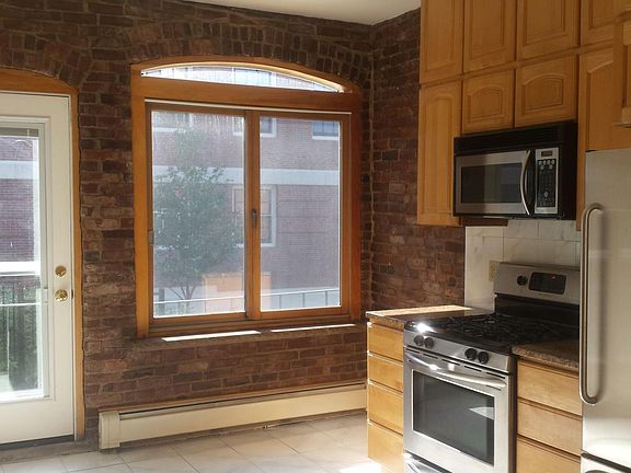 Kitchen wall--Double brick arches, all insulated glass, tile