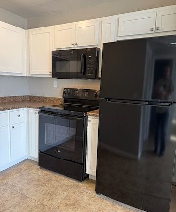 Kitchen close-up to include microwave & additional cupboard space.